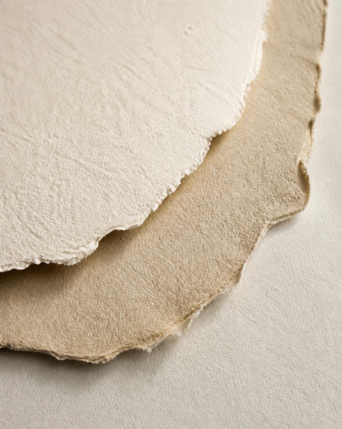 Layered handmade paper with warm cream tones